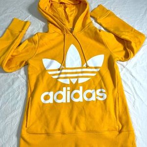 Small yellow adidas sweatshirt.